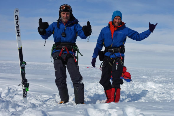 Bruce Corrie (left) and Leo Houlding celebrate a successful day of snowkiting in Greenland